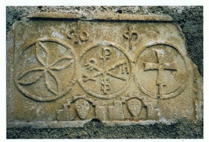 sculpted ornament on a Templar church;  chrismon with the inscription: 'Pax'; photo by JP Schmit